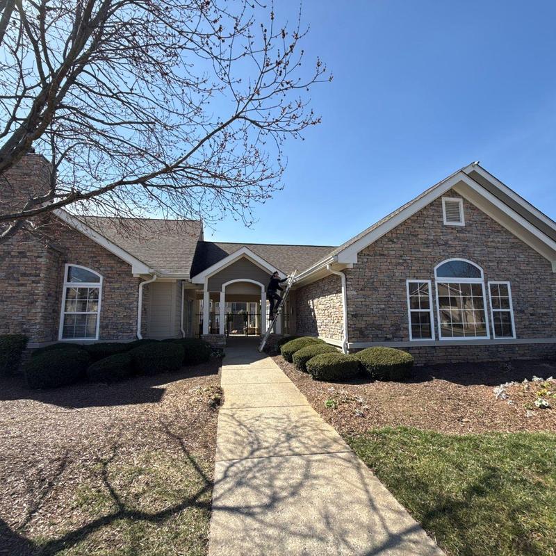Apartment roofing system inspection with ladder access