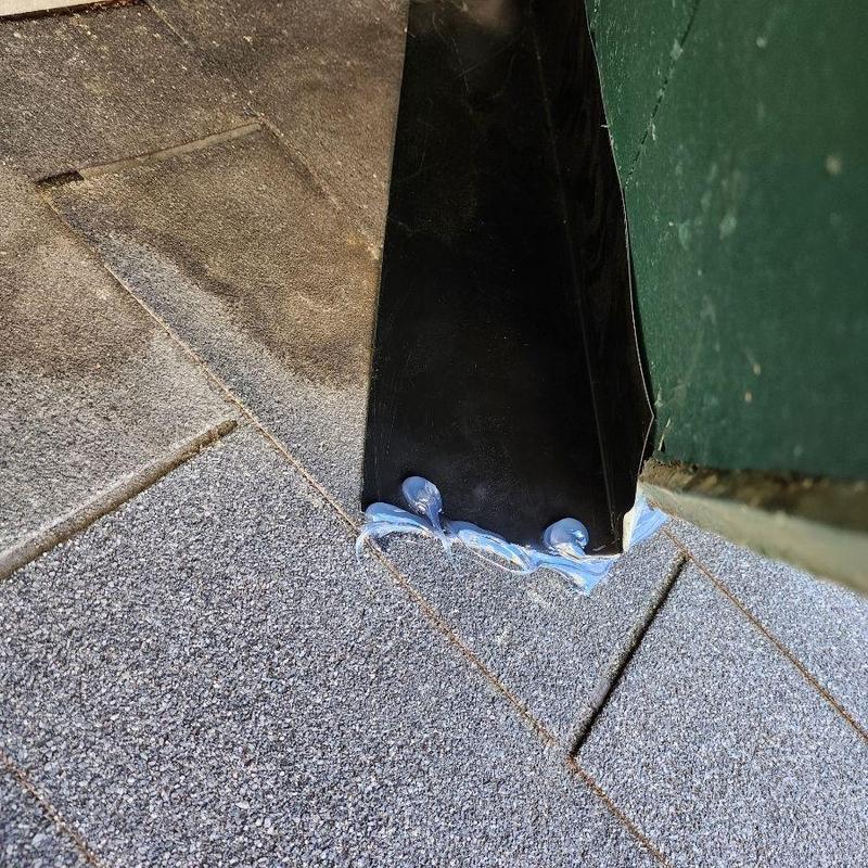 Metal soffit closure with sealant on shingle roof edge Metal soffit closure with sealant on shingle roof edge