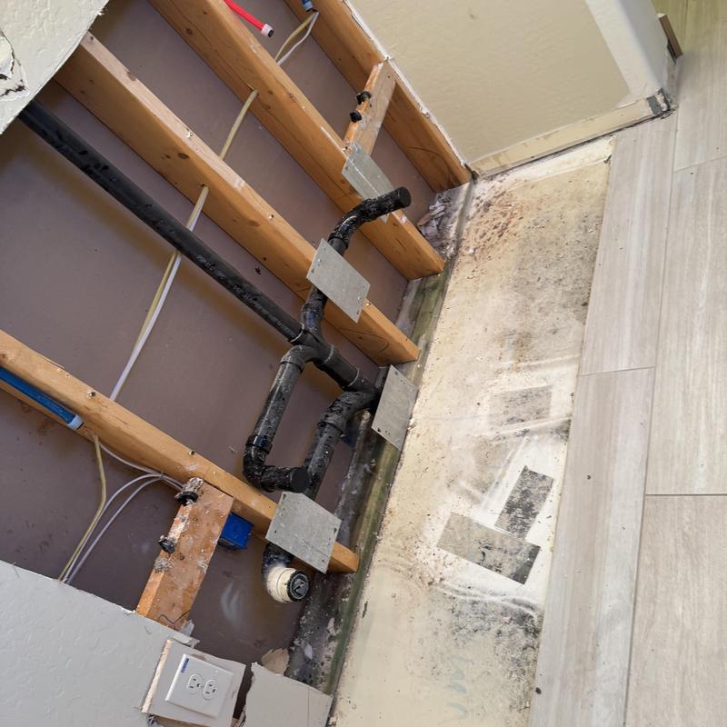 ABS drain piping and wall framing for bathroom vanity