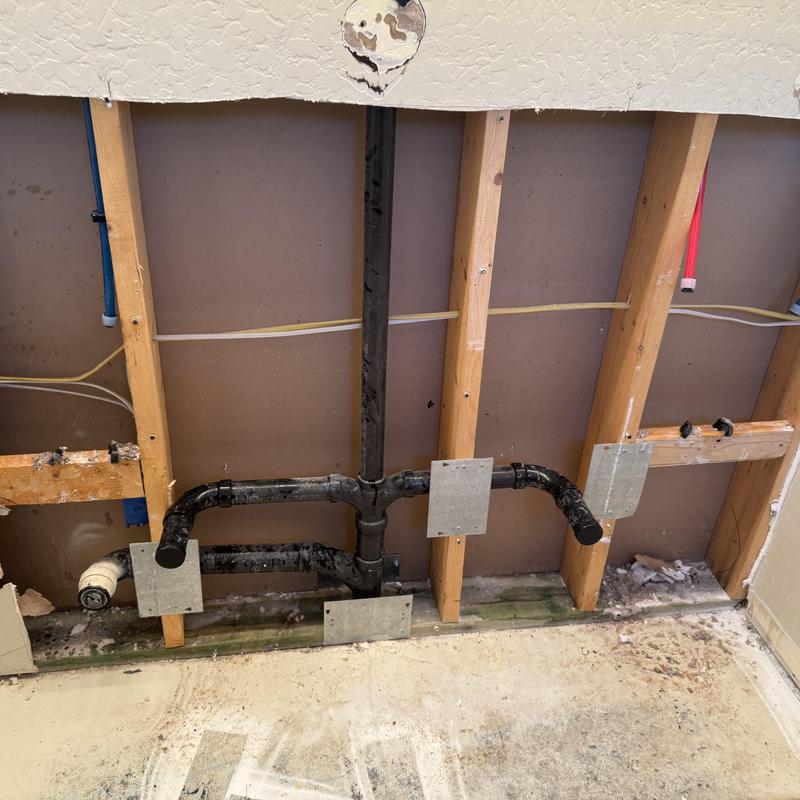 ABS drain pipes and wall framing for bathroom vanity