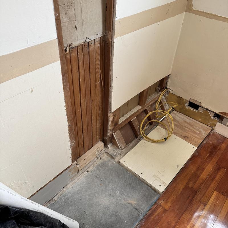 Washer and dryer plumbing and electrical installation area