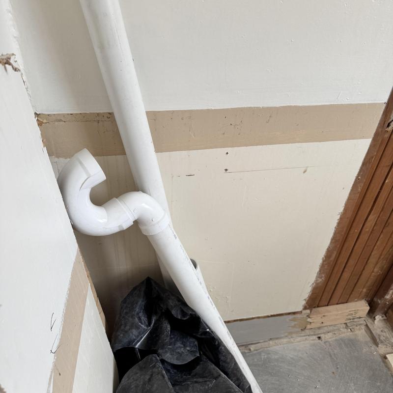 Washer drain plumbing pipes with elbow fitting installation