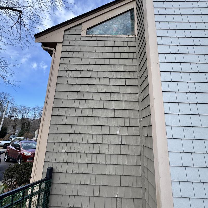 Chimney siding and corner boards with window trim damage