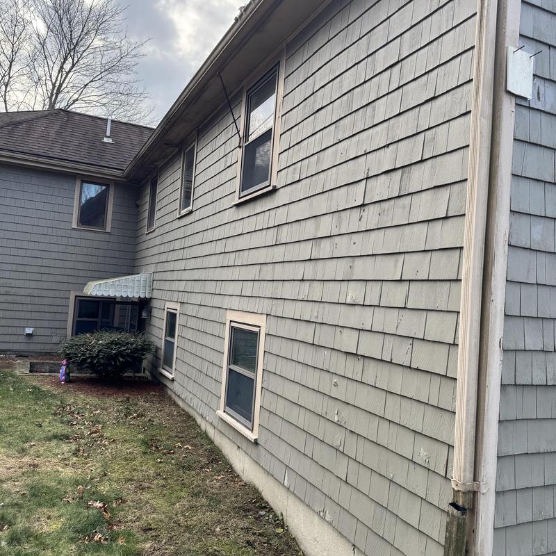 Chimney leak and rotted window trim on siding wall