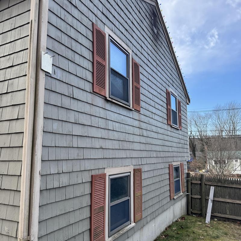Chimney and side wall siding with rotted trim boards