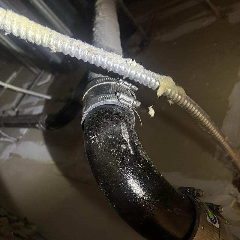 Cast iron 90-degree pipe elbow with clamps installation