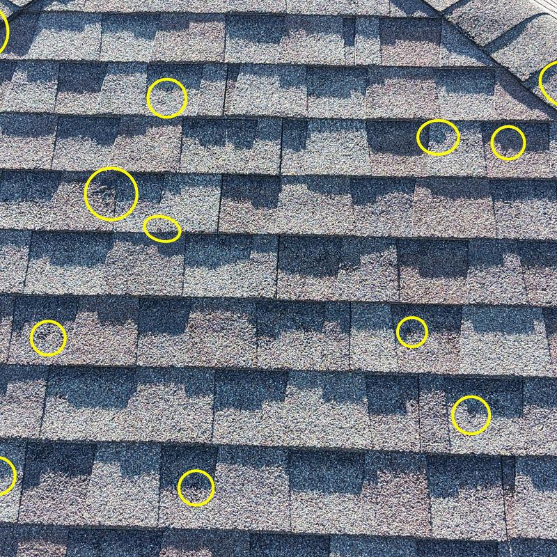 Asphalt shingle roof hail damage inspection with marked spots