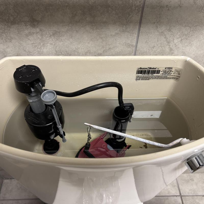 Toilet fill valve and flush valve inside tank