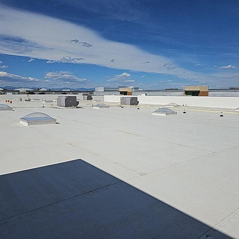 TPO flat roof with repaired seams and patches TPO flat roof with repaired seams and patches