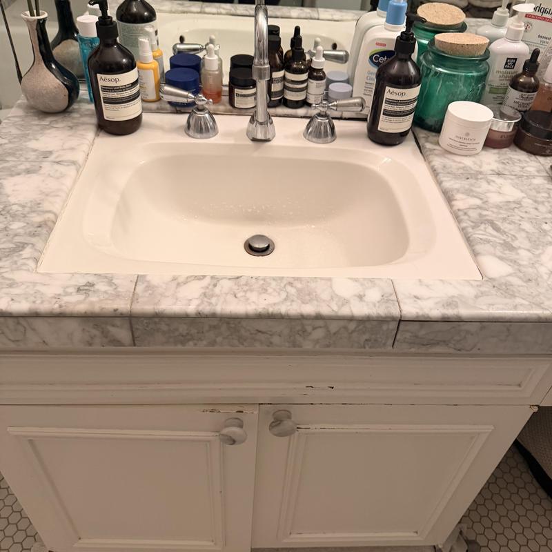 Old Chicago widespread faucet with marble countertop