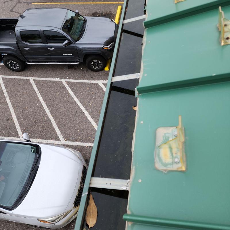 Metal roof panel ridge with gutter maintenance view Metal roof panel ridge with gutter maintenance view