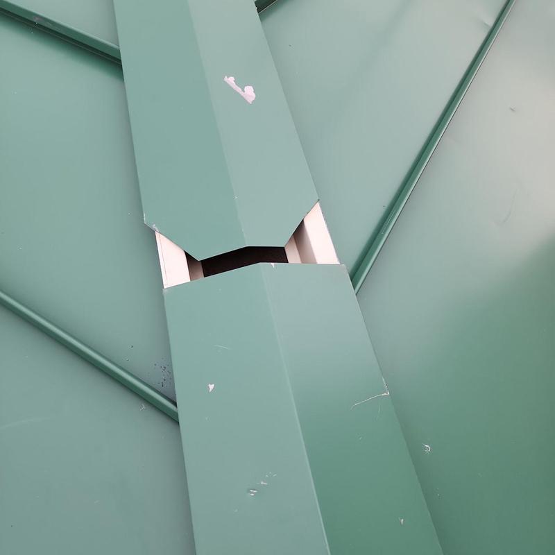 Metal roof panel with loose ridge section gap Metal roof panel with loose ridge section gap