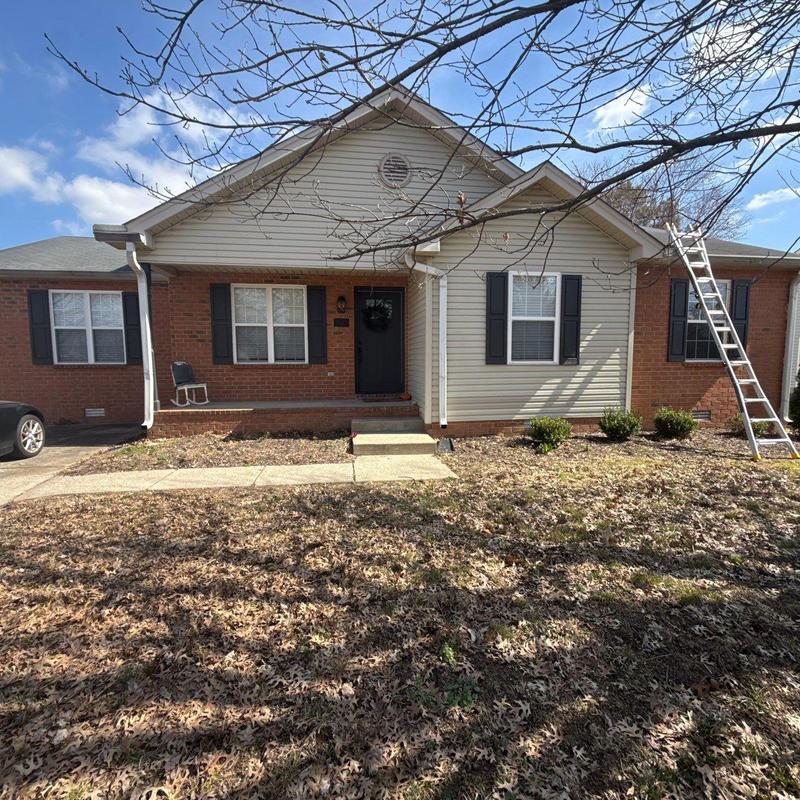 Asphalt shingle roof with ladder for inspection