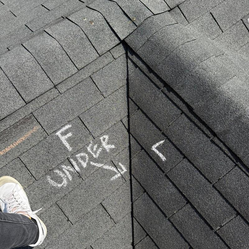 Asphalt shingles with hail damage and chalk markings