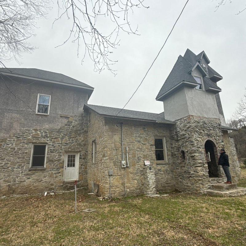 Schoolhouse roof with hail damage and flashing issues