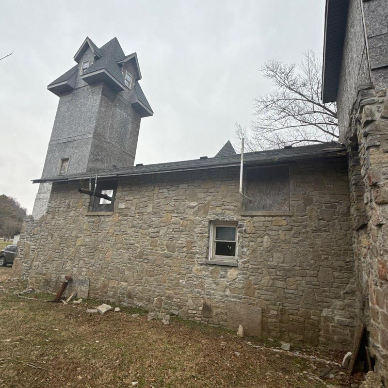 Schoolhouse roof and flashing with hail damage