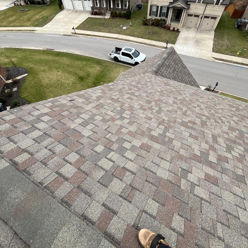 Asphalt shingle roof with hail damage inspection