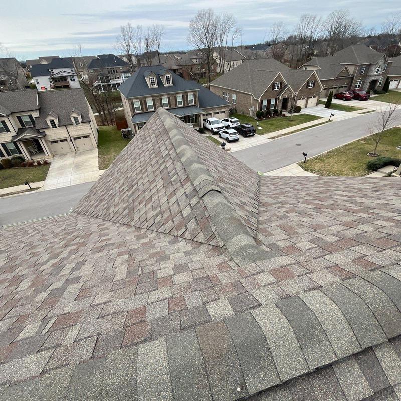 Asphalt shingle roof with ridge cap inspection