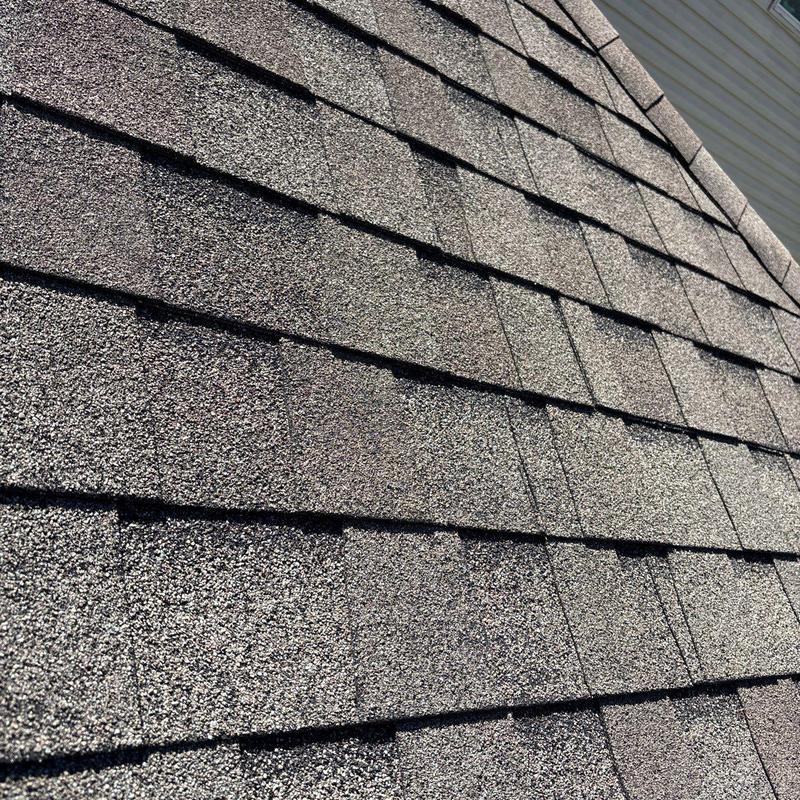 Asphalt shingle roof with visible hail damage