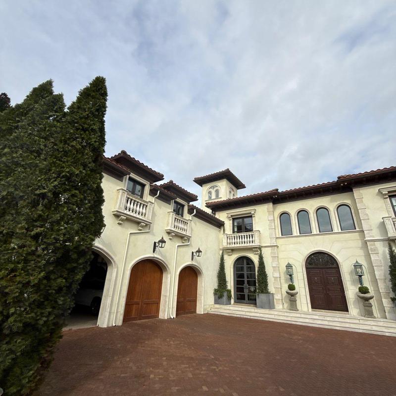 Clay tile roof inspection on Mediterranean-style home