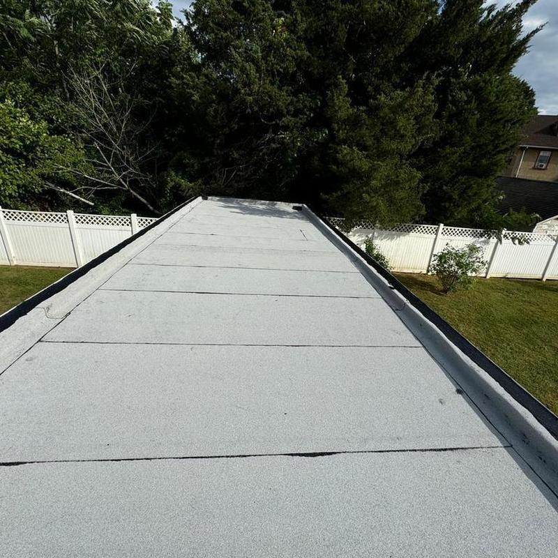 Firestone Modified Bitumen flat roof system on house Firestone Modified Bitumen flat roof system on house