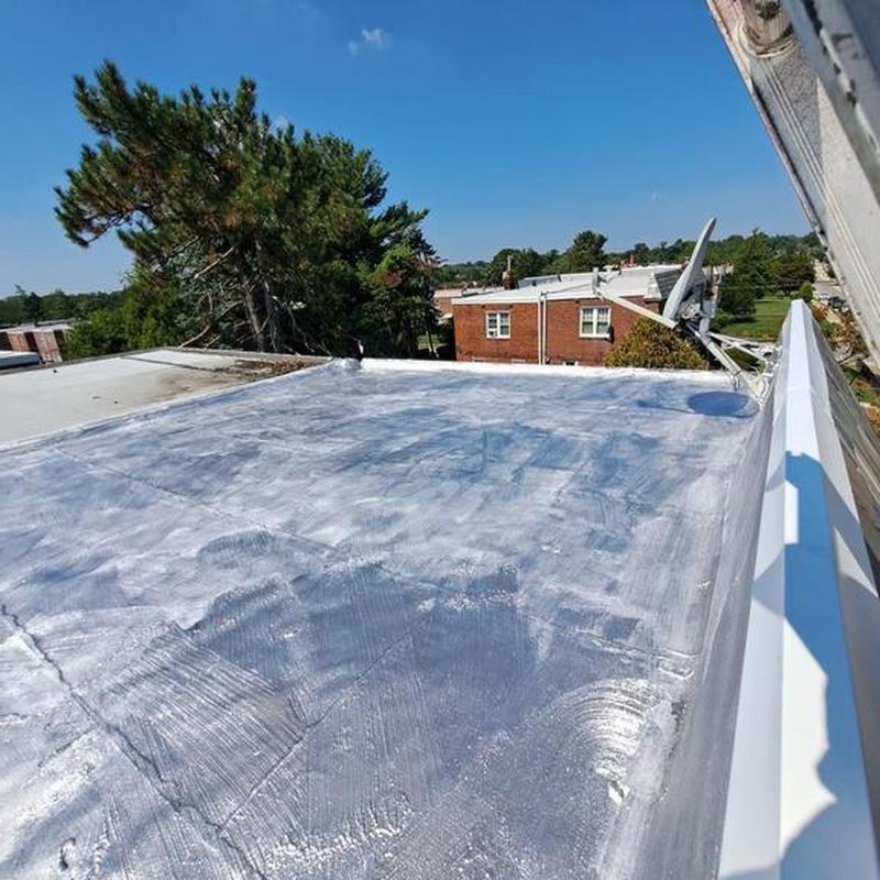 Flat roof aluminum silver coating on residential building