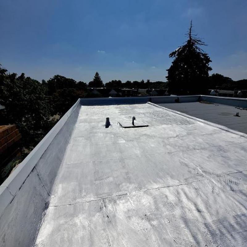 Flat roof with aluminum silver coating maintenance