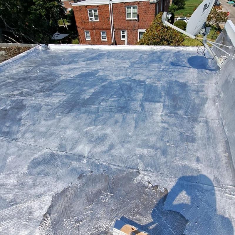 Flat roof aluminum coating with cement patches