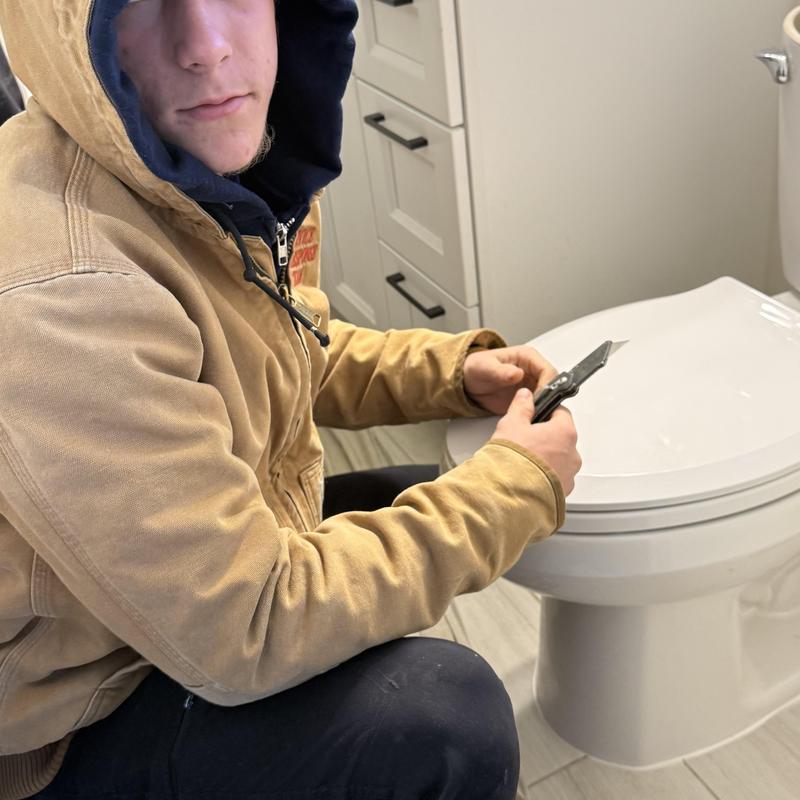 Toilet with clogged drain inspection and repair