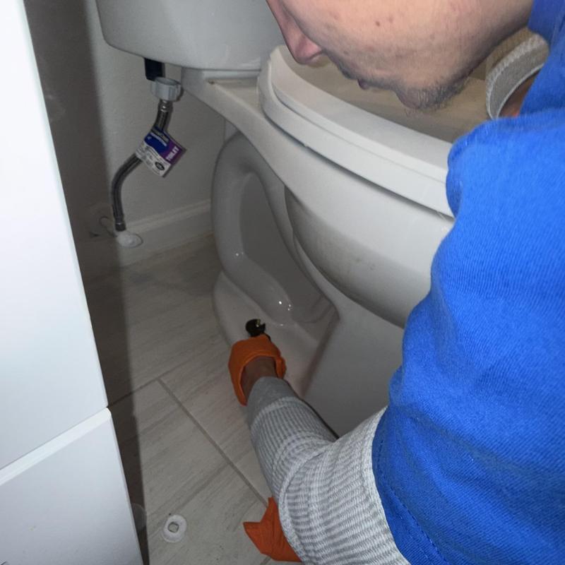 Toilet base seal removal during clog service