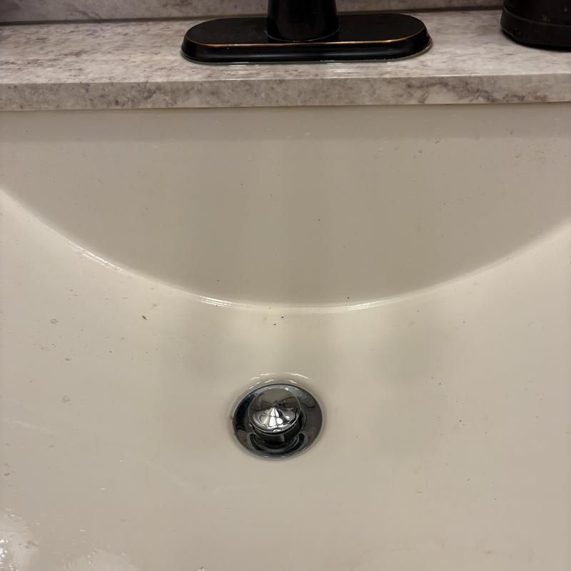 Pop-up drain assembly in bathroom sink