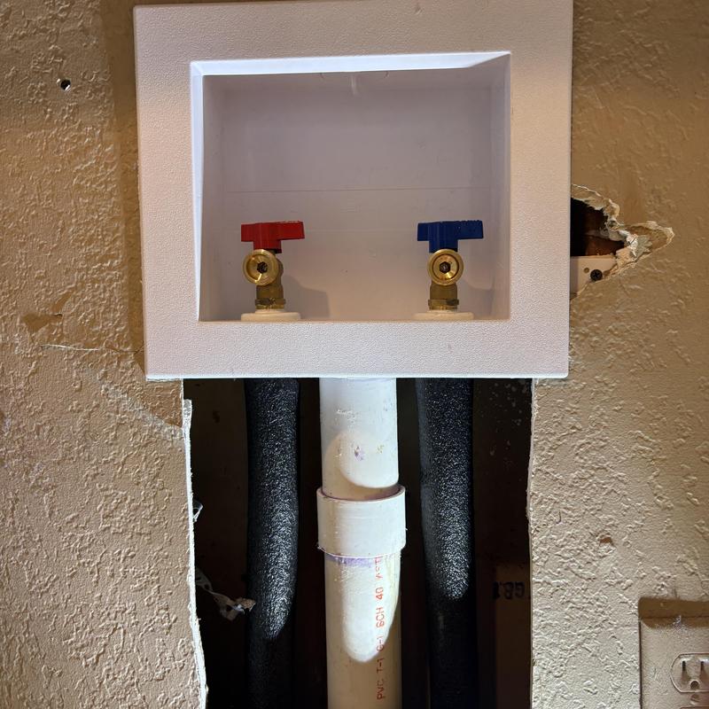 Washer machine valve box with red and blue valves