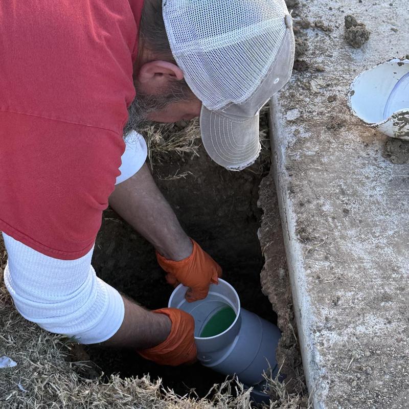 Sewer cleanout pipe installation in ground hole