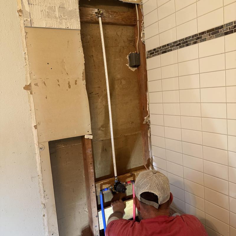 Tub and shower valve installation in bathroom wall