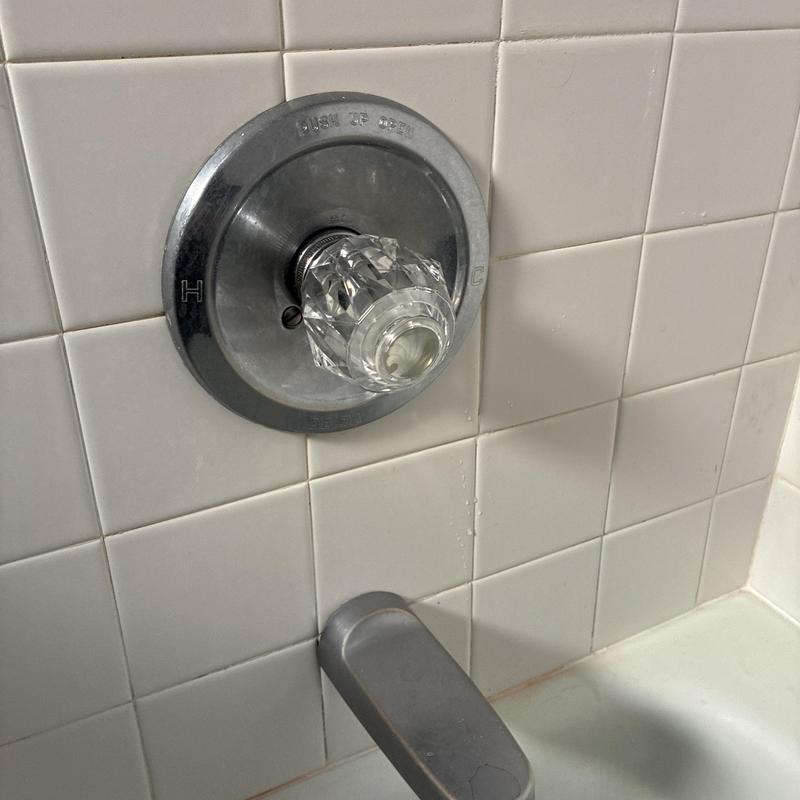 Shower faucet handle replacement on tiled wall