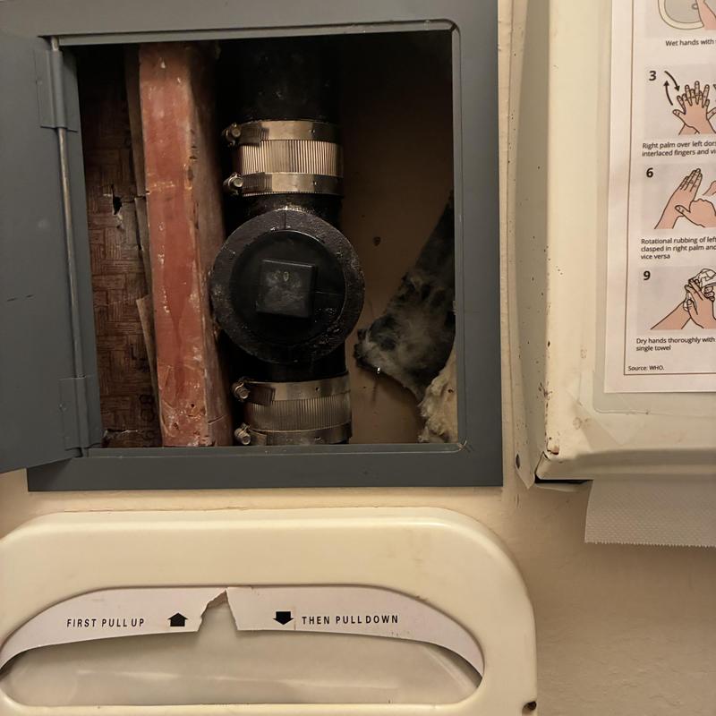 Main sewer line cleanout with metal band clamps