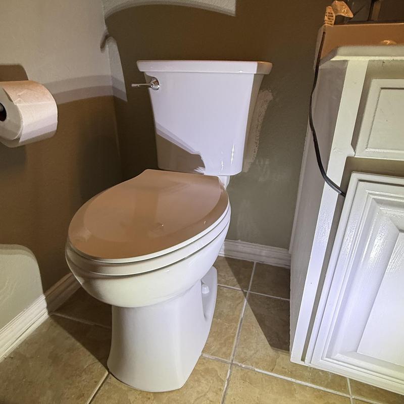 Toilet replacement in residential bathroom corner
