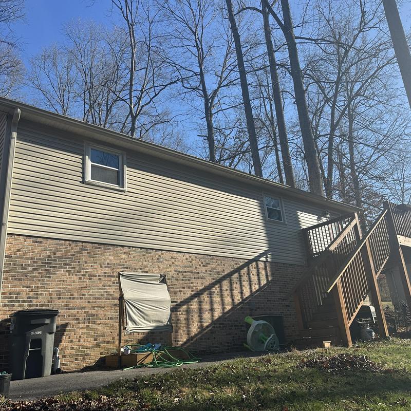 Asphalt shingle roof on residential house in winter