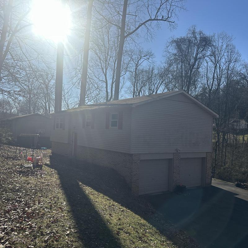 Asphalt roof on residential home with sun glare