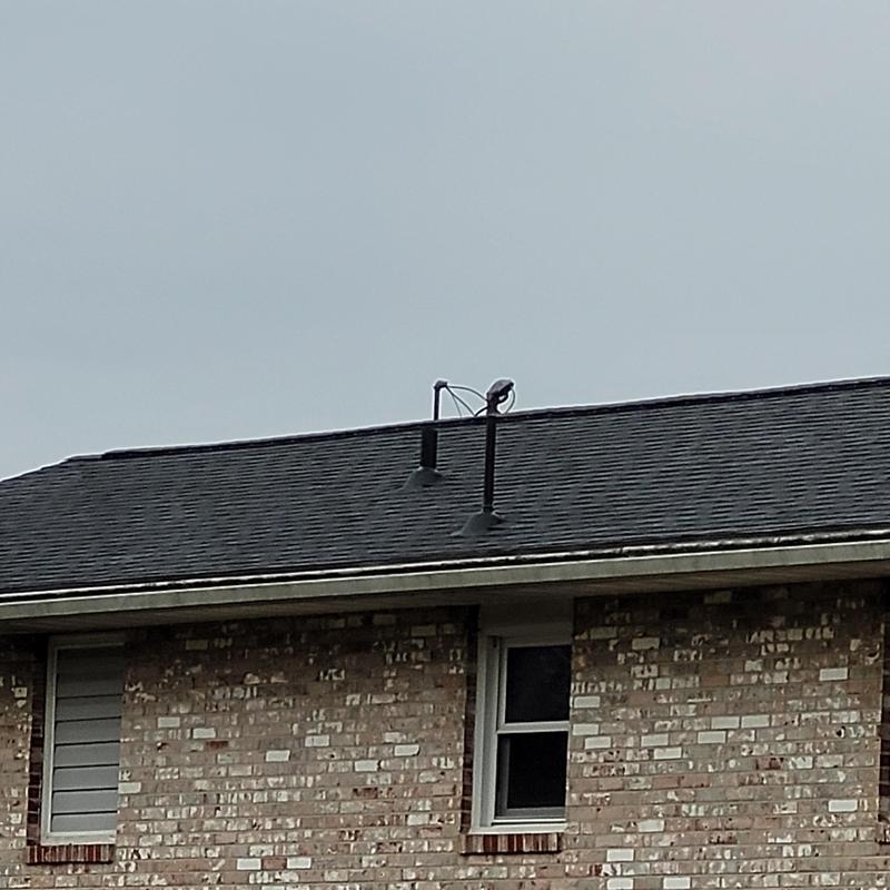 Asphalt shingle roof on ranch style brick house