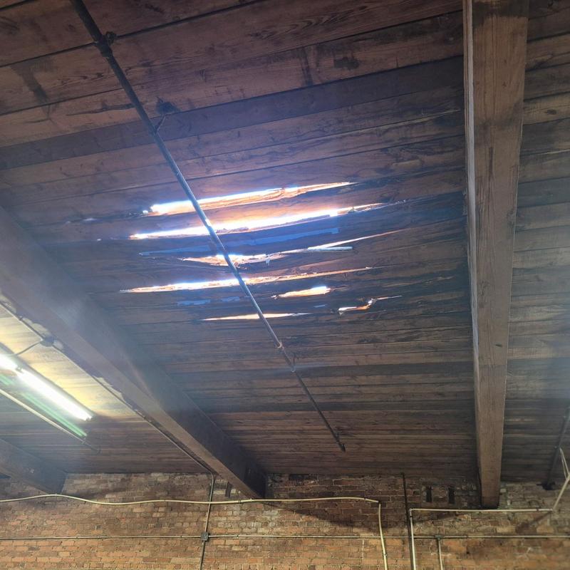 Wood deck with rot and ceiling gaps in roof structure
