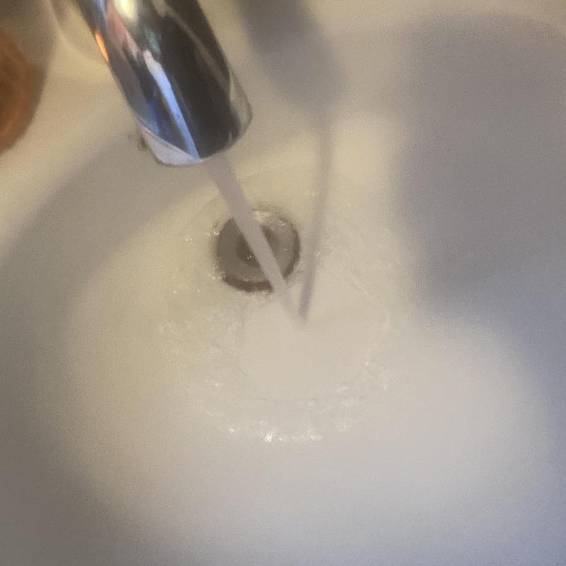 Basin sink drain clearing with flowing water