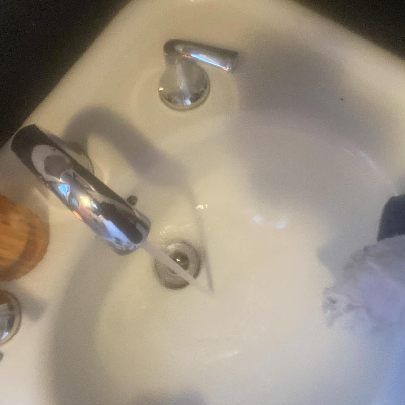 Basin sink drain with running water and faucet