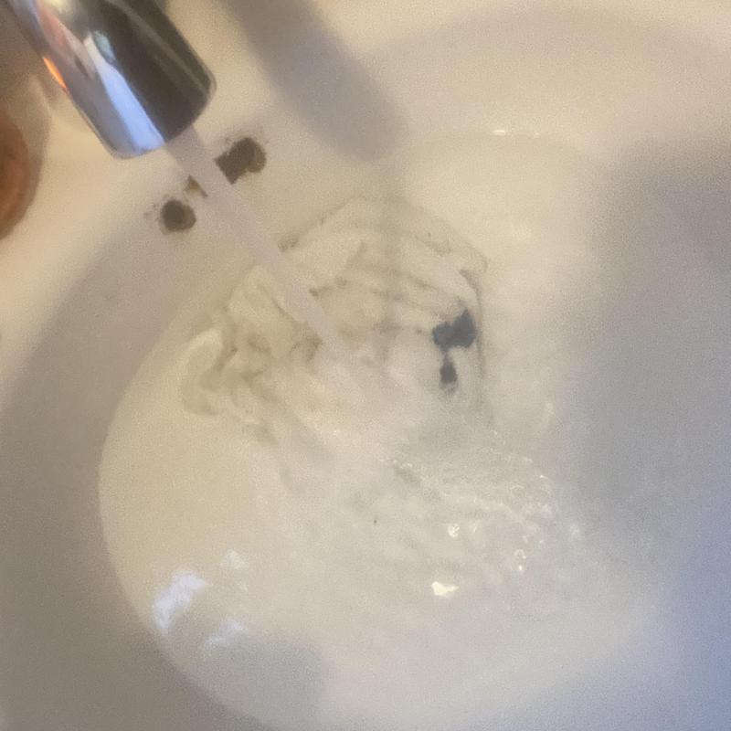 Basin sink drain clearing with flowing water