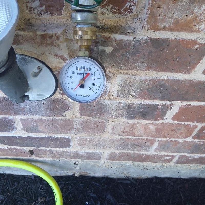 Water pressure gauge on outdoor hose bibb valve