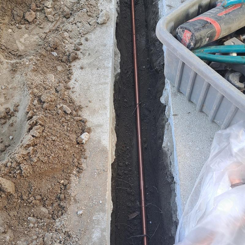 Copper cold water line trench under cement slab Copper cold water line trench under cement slab