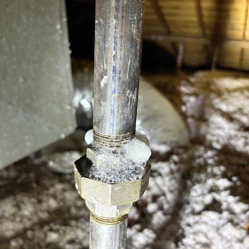 Gas line fitting with leak detection bubbles in attic