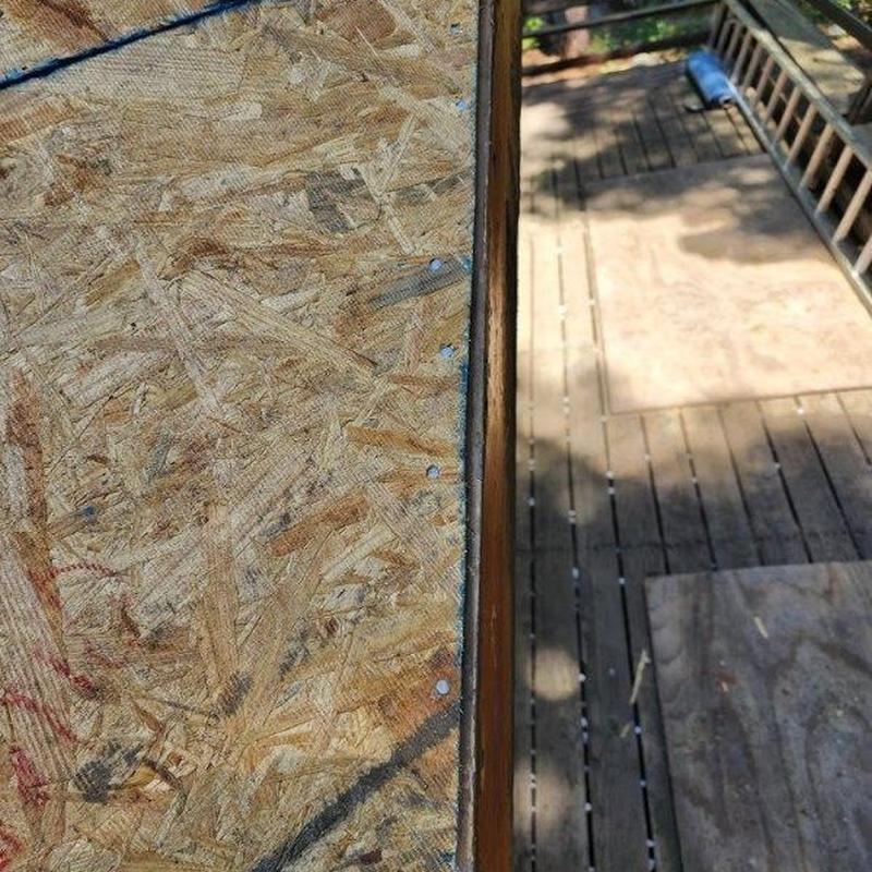 OSB roof sheathing installed on cabin roof decking