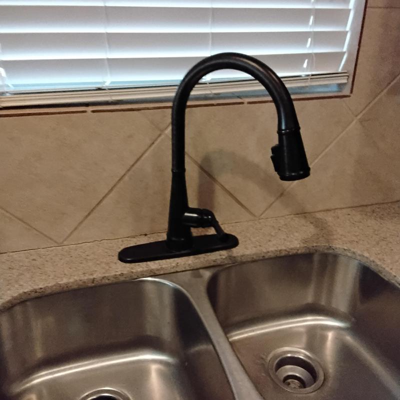 Kitchen faucet and double sink installation near window