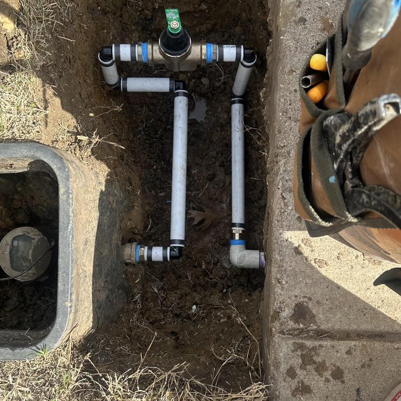 Pressure reducing valve and PVC water piping in trench